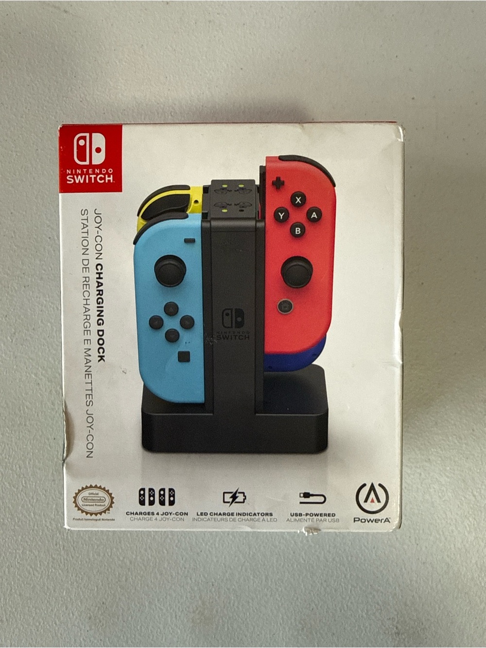 Nintendo Joy-Con Charging Dock with Blue and Red Controllers